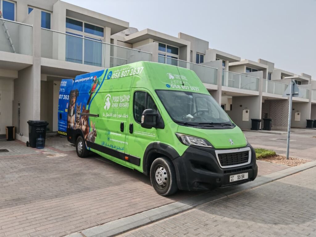 Green mobile pet grooming van in Dubai